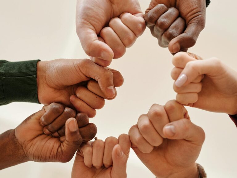 Close-up of People Bumping Fists