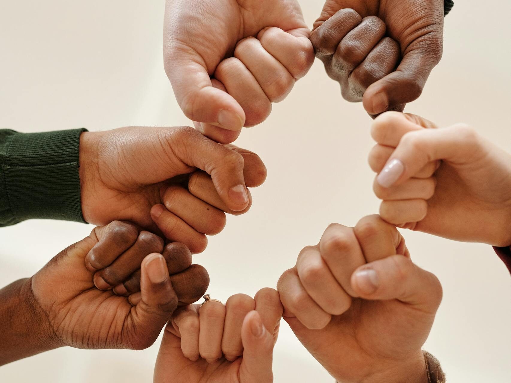 Close-up of People Bumping Fists